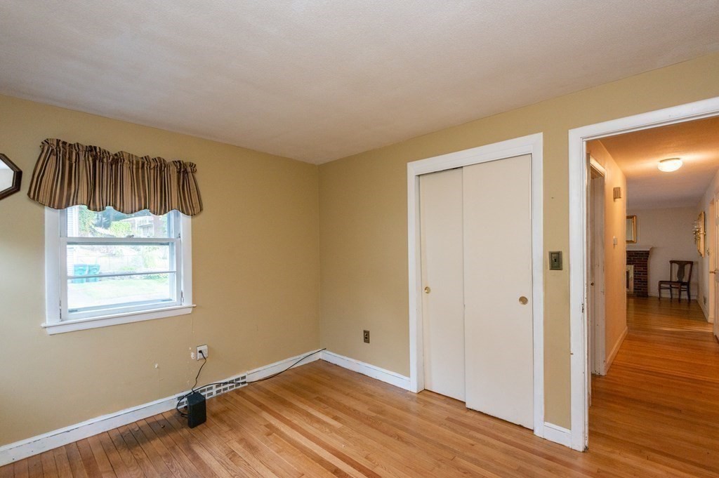 91 Brookside Road Lynn, MA 01902 - Photo 15 of 28 wooden floor in an empty room with a window
