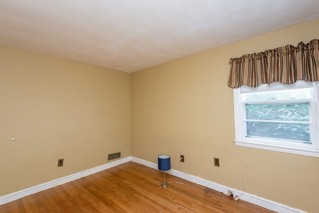 91 Brookside Road Lynn, MA 01902 - Photo 17 of 28 a view of a room with wooden floor and a window