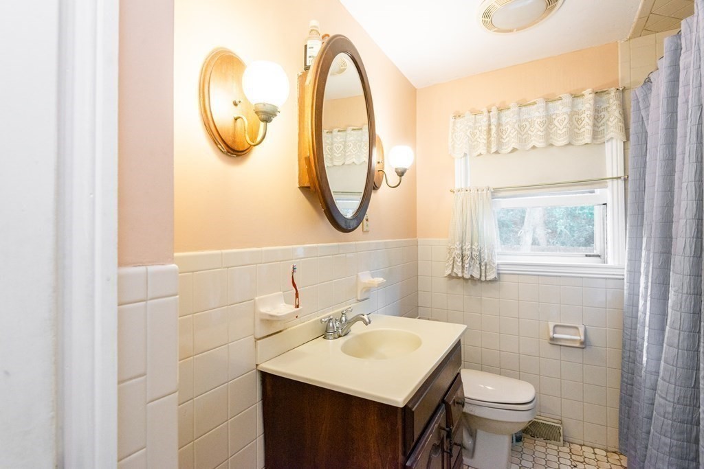 91 Brookside Road Lynn, MA 01902 - Photo 20 of 28 a bathroom with a sink and a mirror