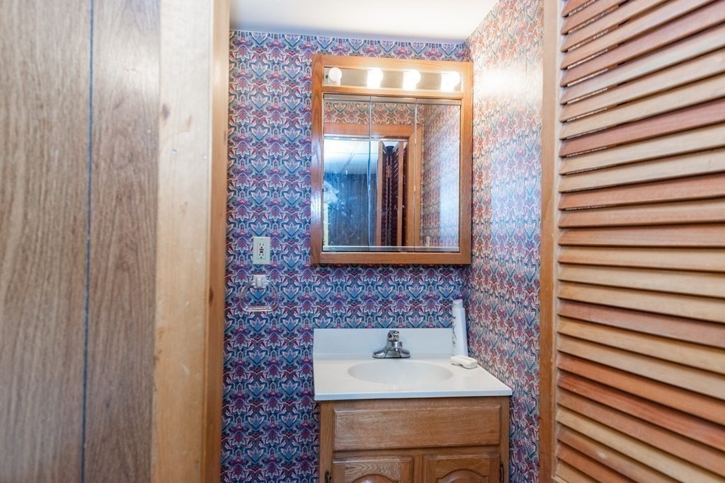 91 Brookside Road Lynn, MA 01902 - Photo 24 of 28 a bathroom with a sink and a mirror