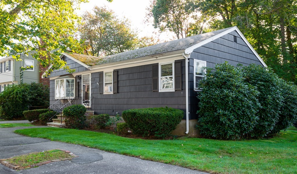 91 Brookside Road Lynn, MA 01902 - Photo 26 of 28 a view of a house with a yard plants and large tree