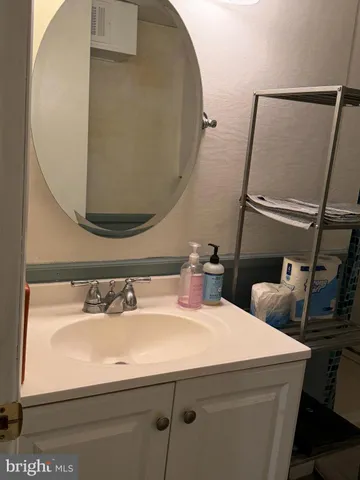 a bathroom with a sink and mirror
