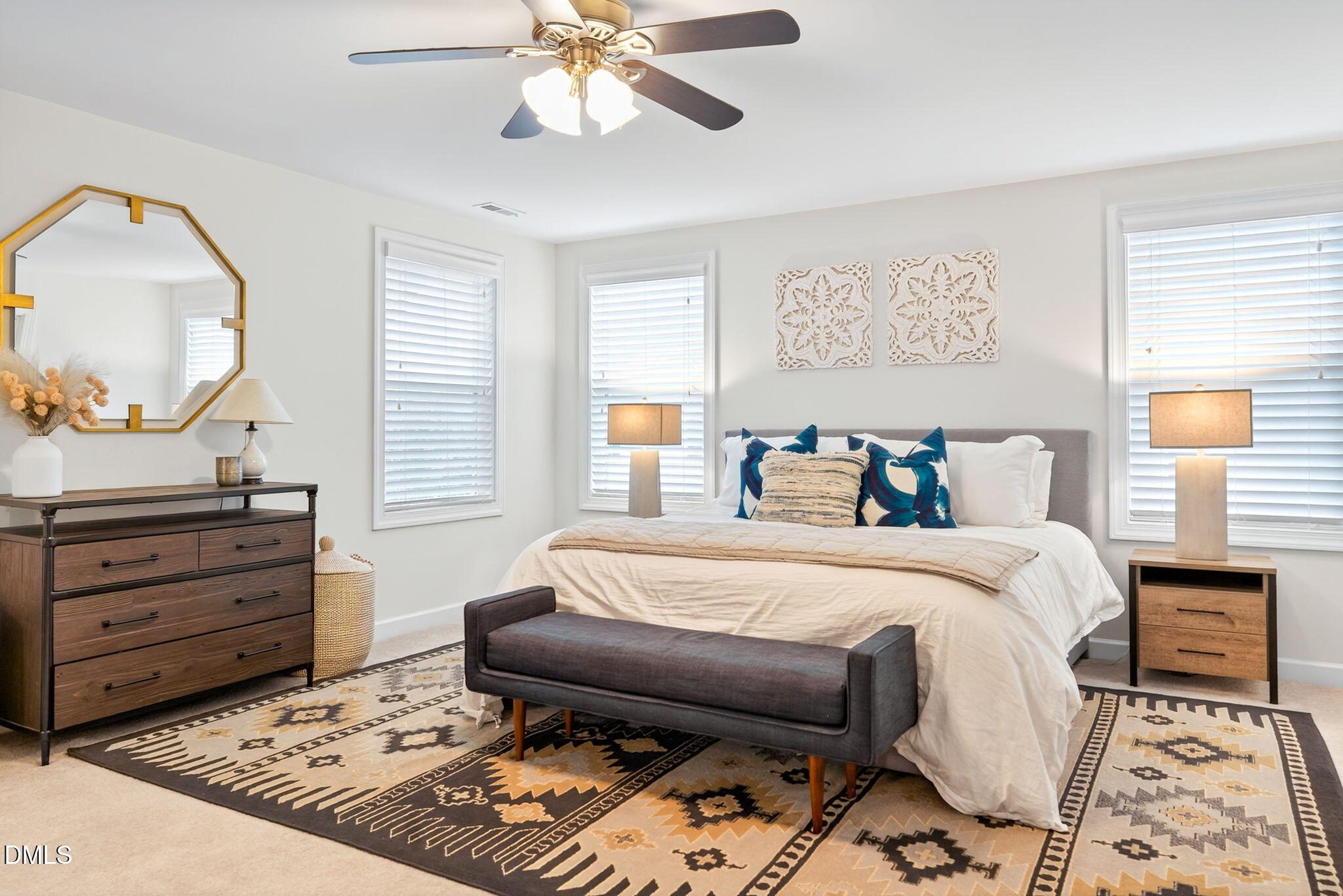 2928 Murray Rdg Trail Apex, NC 27502 - Photo 14 of 35 a bedroom with a bed and a mirror on the dresser