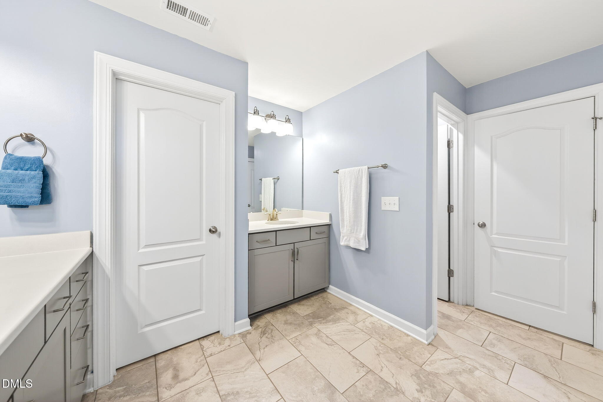 2928 Murray Rdg Trail Apex, NC 27502 - Photo 18 of 35 a bathroom with a sink and a mirror