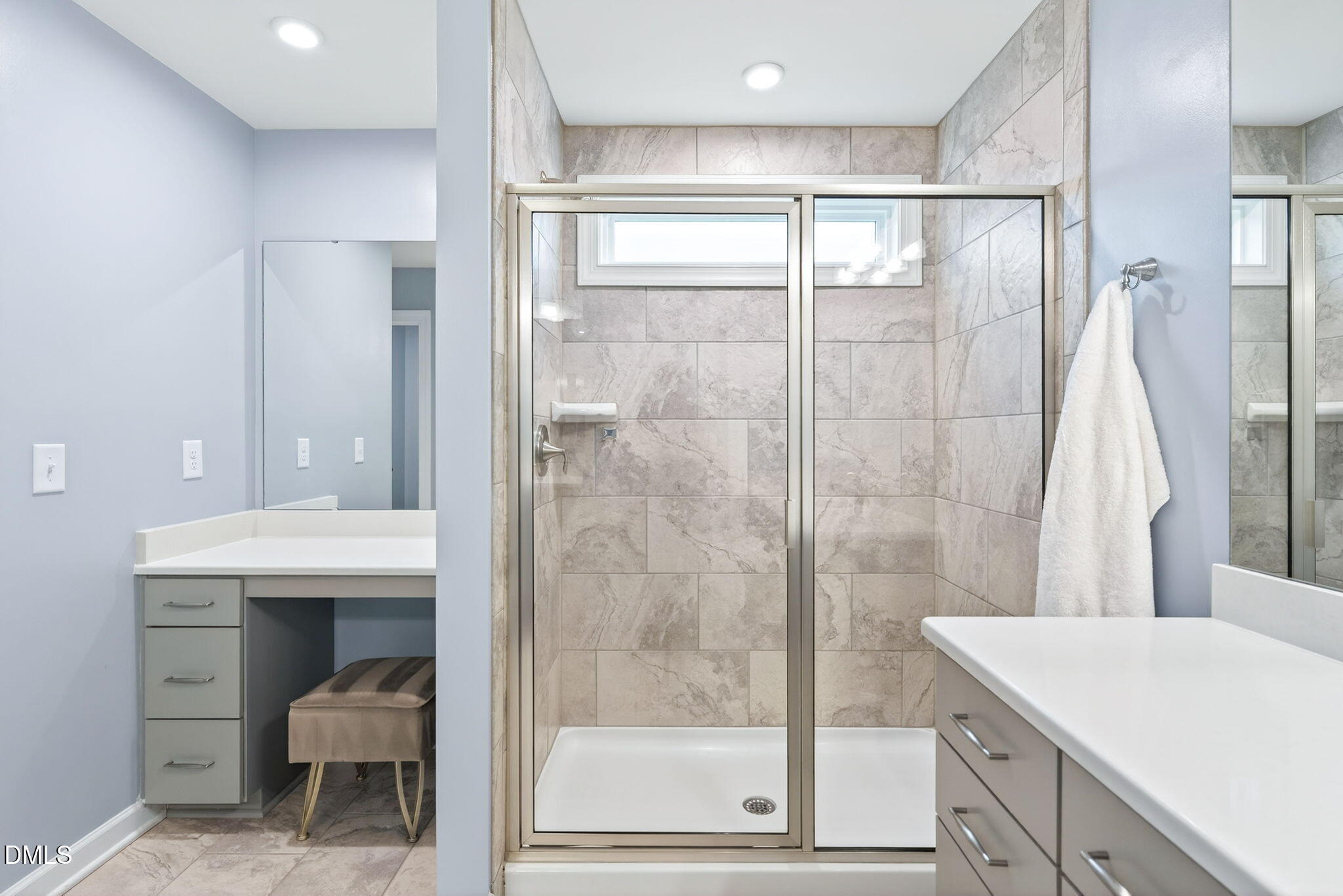 2928 Murray Rdg Trail Apex, NC 27502 - Photo 19 of 35 a bathroom with a shower sink and mirror