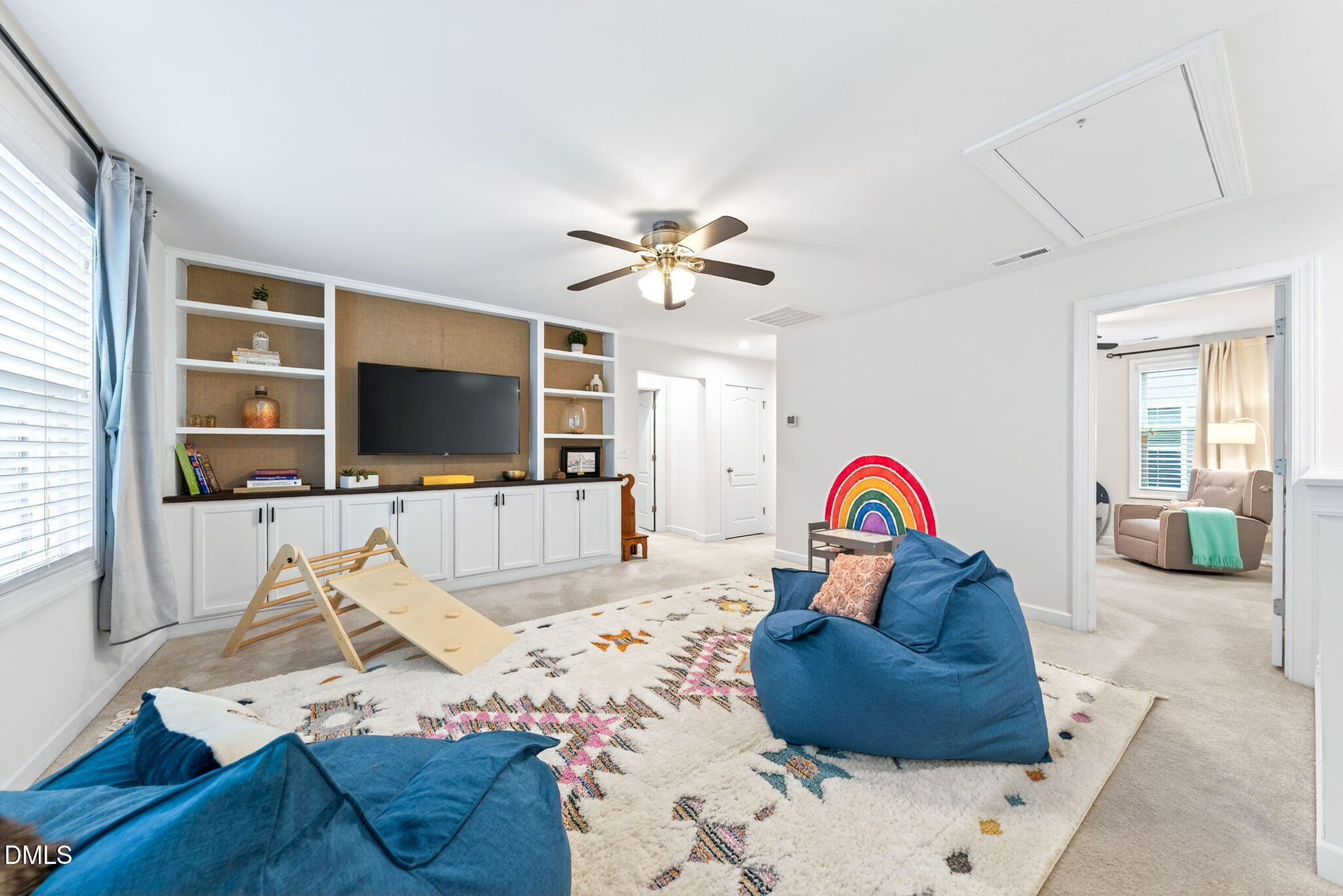 2928 Murray Rdg Trail Apex, NC 27502 - Photo 21 of 35 a living room with furniture and a flat screen tv