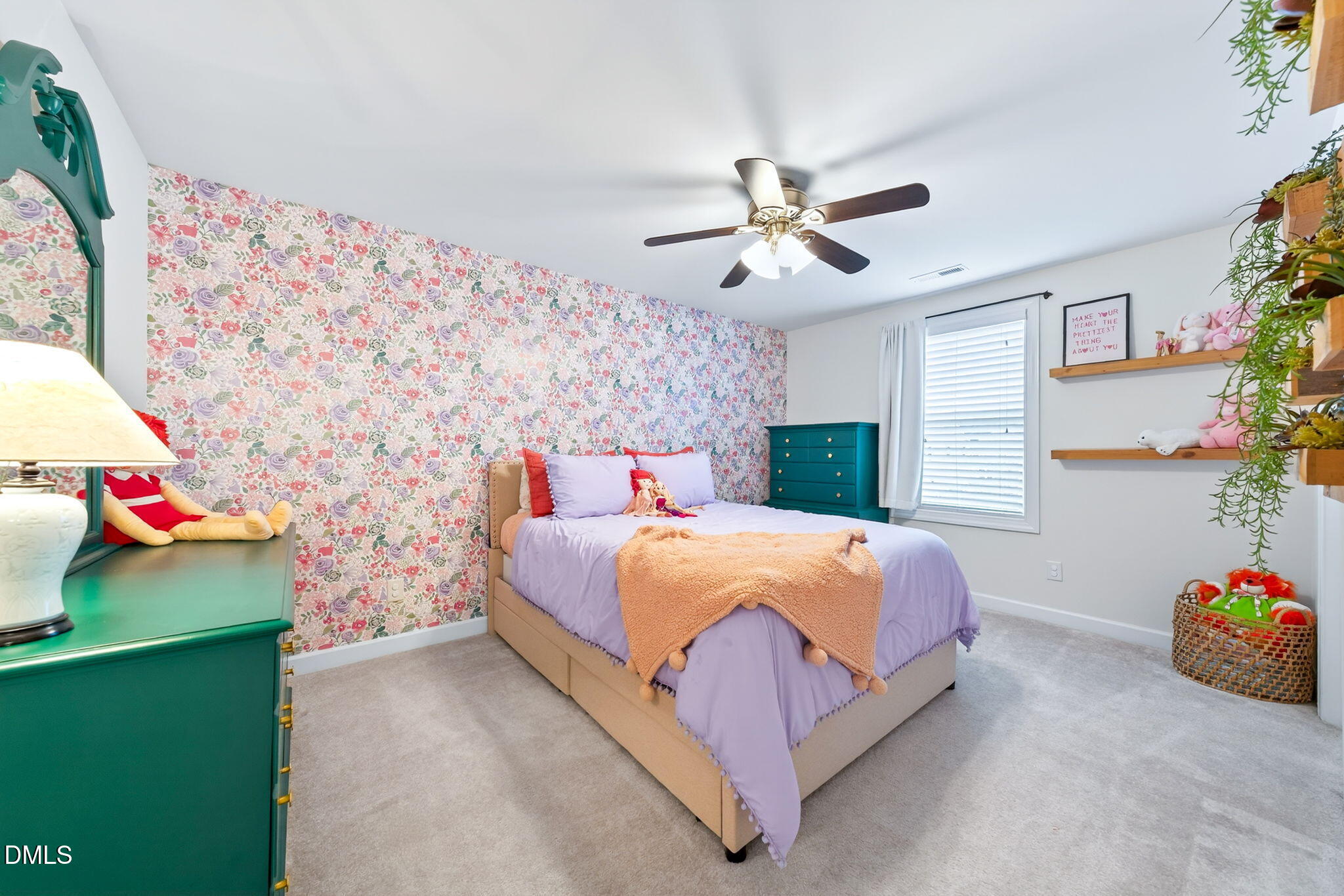 2928 Murray Rdg Trail Apex, NC 27502 - Photo 23 of 35 a bedroom with a bed dresser and a potted plant