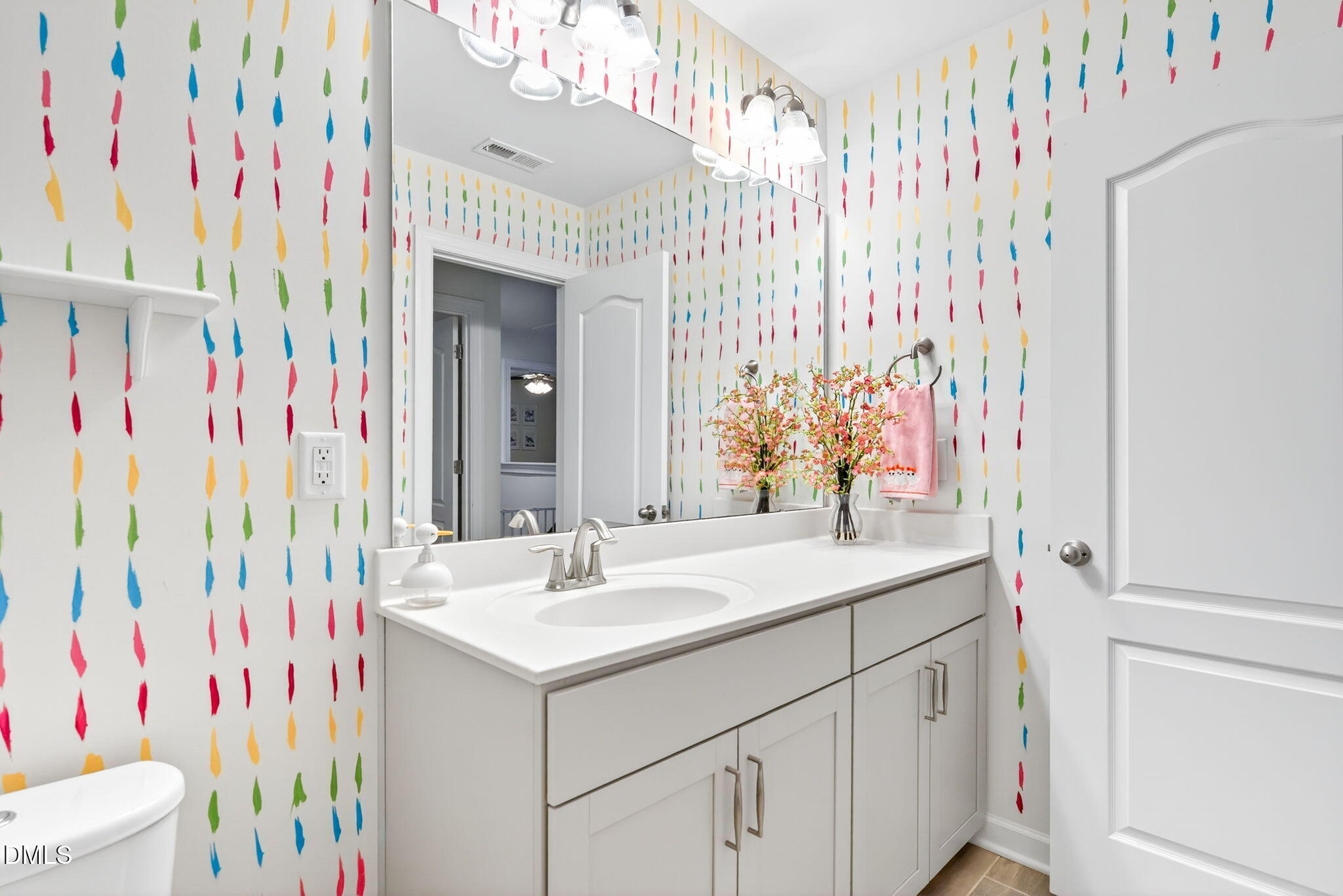 2928 Murray Rdg Trail Apex, NC 27502 - Photo 25 of 35 a bathroom with a sink and a mirror