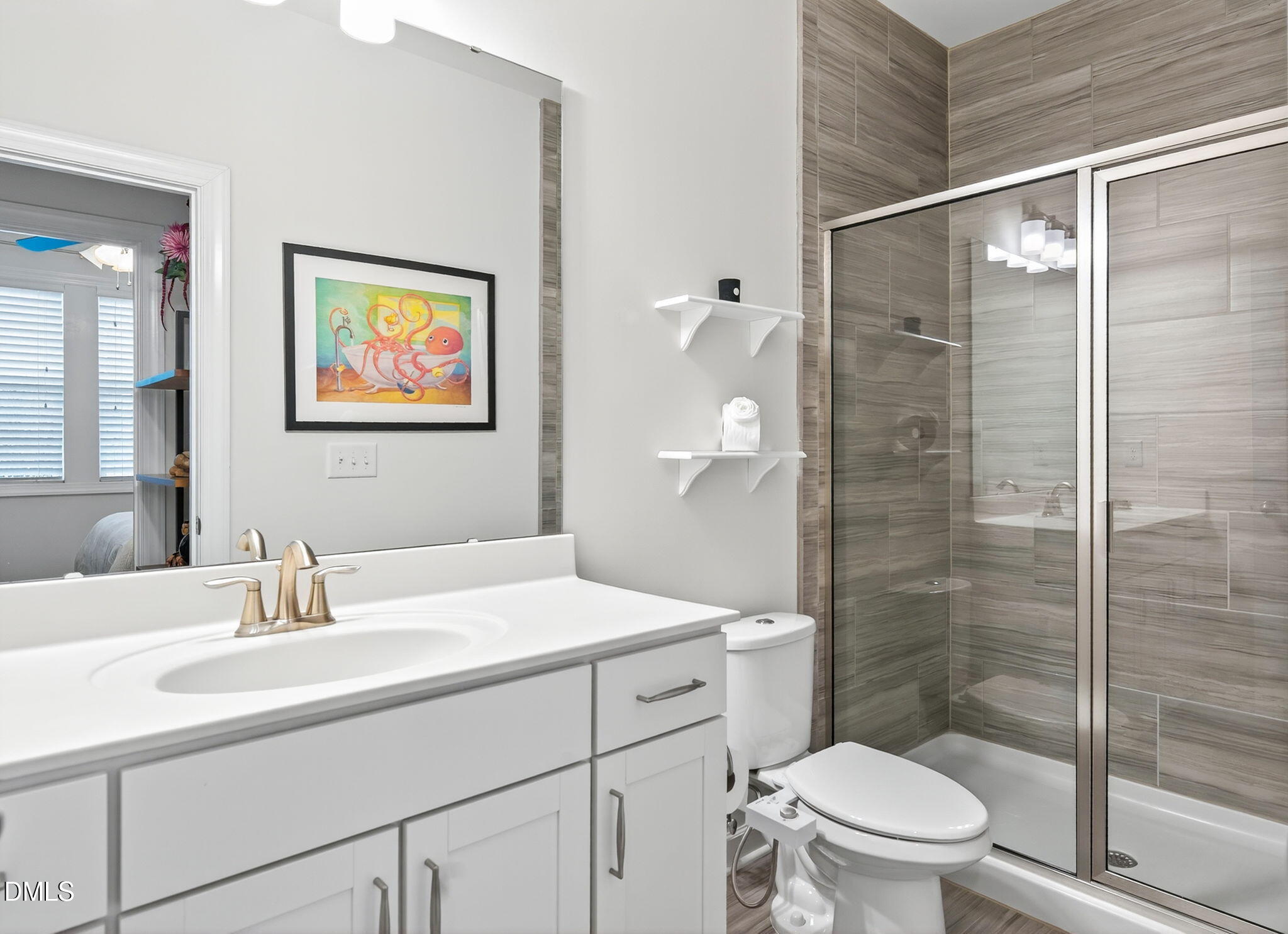 2928 Murray Rdg Trail Apex, NC 27502 - Photo 28 of 35 a bathroom with a sink toilet and shower
