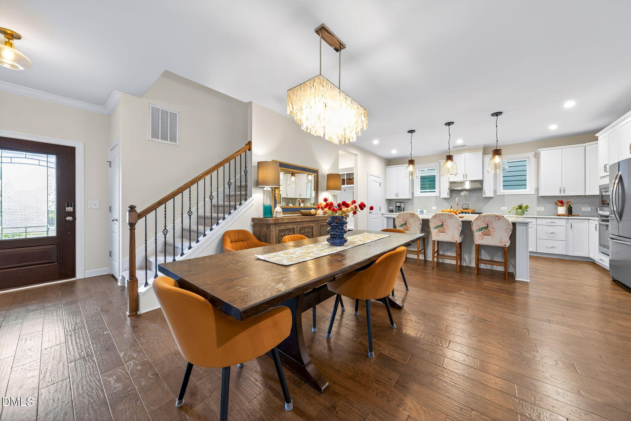 2928 Murray Rdg Trail Apex, NC 27502 - Photo 6 of 35 a view of a dining room with furniture and wooden floor