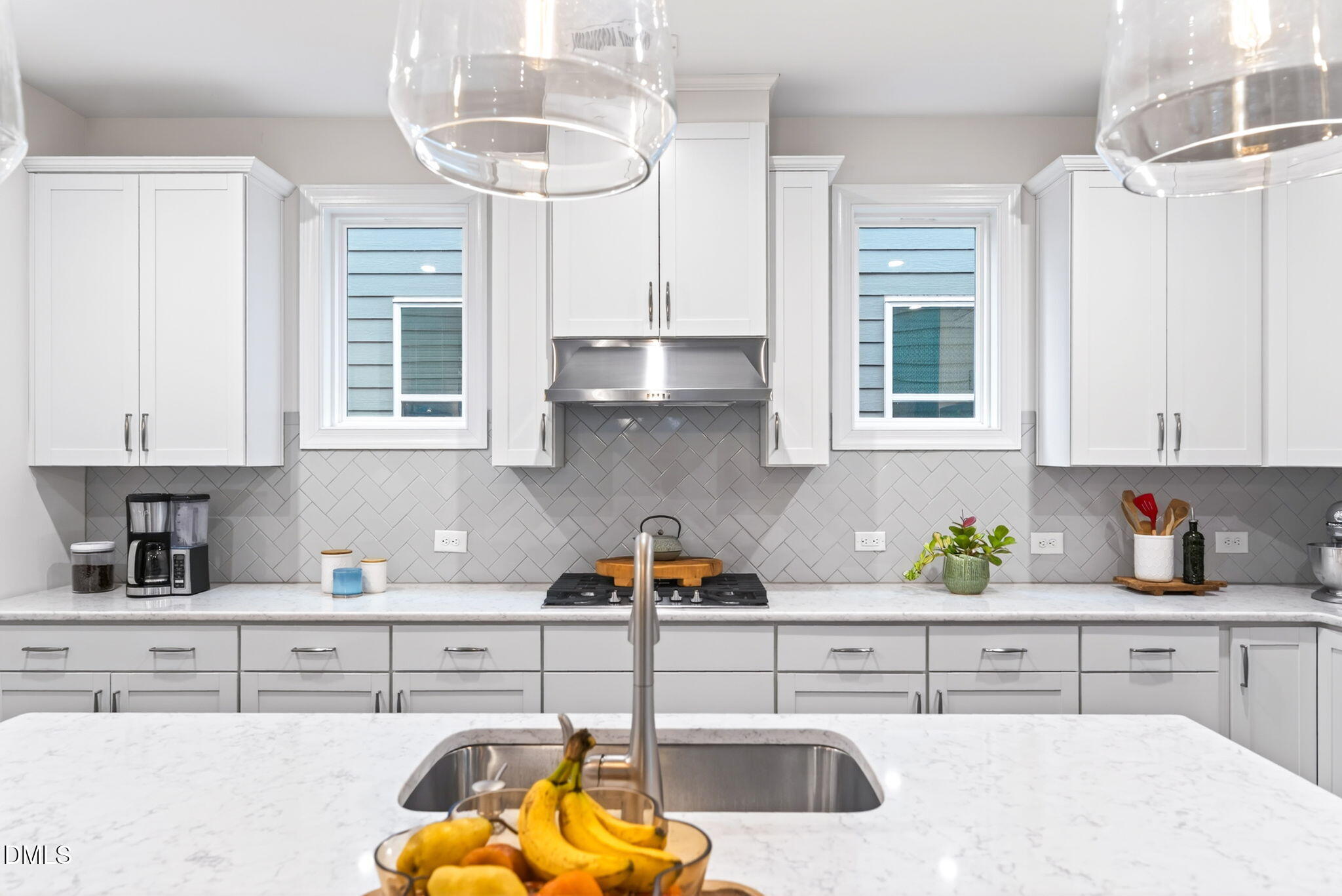 2928 Murray Rdg Trail Apex, NC 27502 - Photo 8 of 35 a kitchen with stainless steel appliances granite countertop a sink a stove and a white cabinets