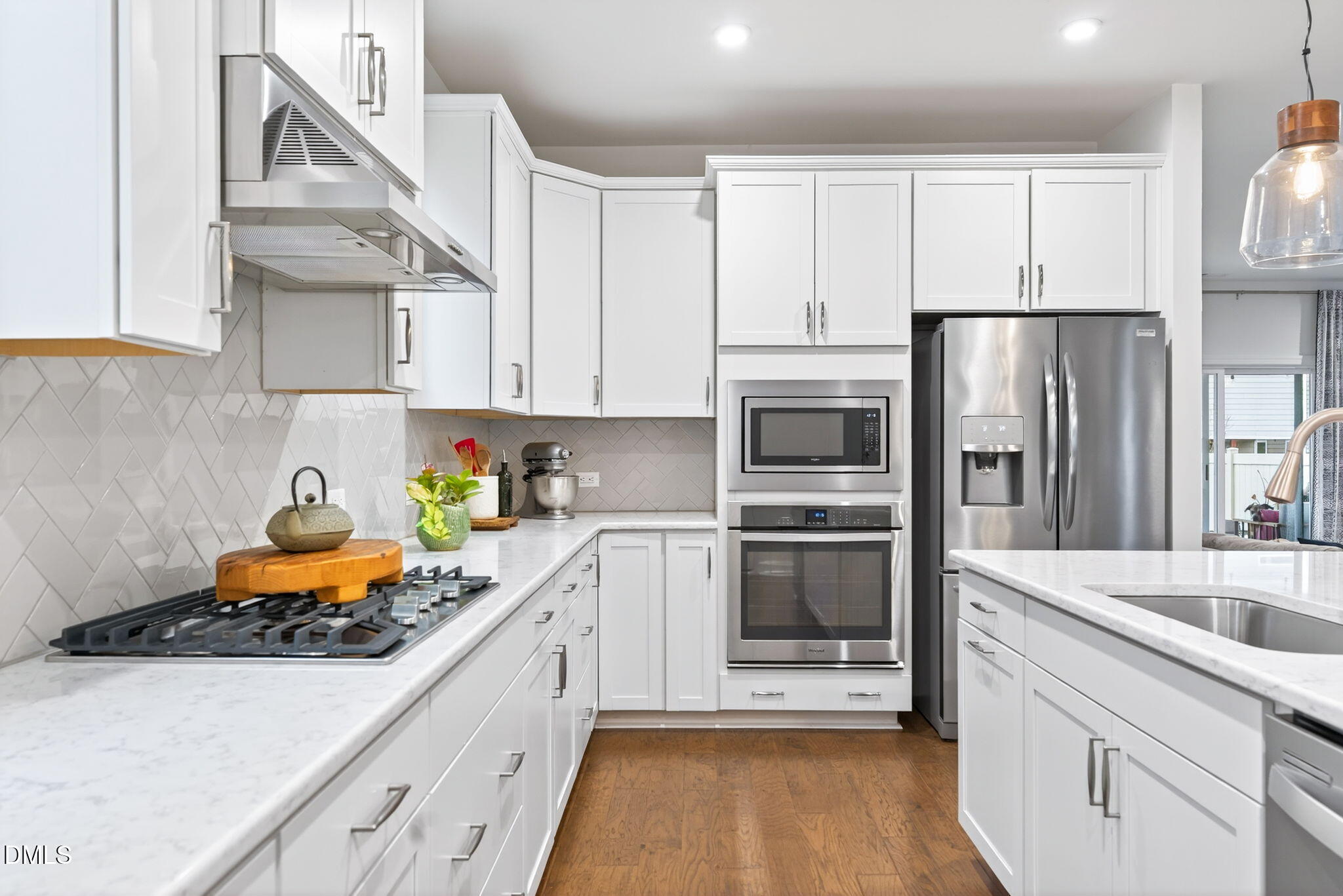2928 Murray Rdg Trail Apex, NC 27502 - Photo 9 of 35 a kitchen with stainless steel appliances granite countertop a refrigerator and a stove top oven