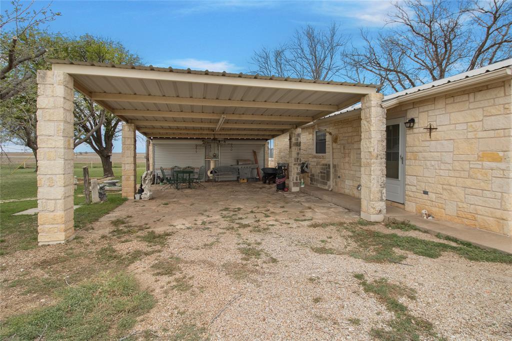 2102 County Road 233 Ballinger, TX 76821 - Photo 2 of 16 a view of a room with a wooden fence