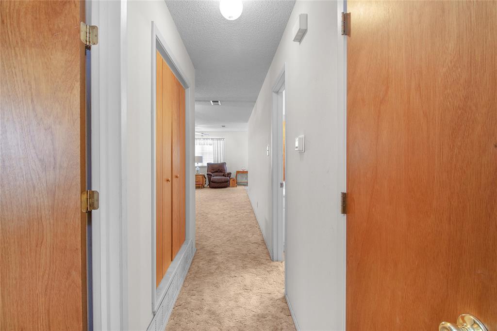 2102 County Road 233 Ballinger, TX 76821 - Photo 8 of 16 a view of a hallway with a furniture and a bathroom