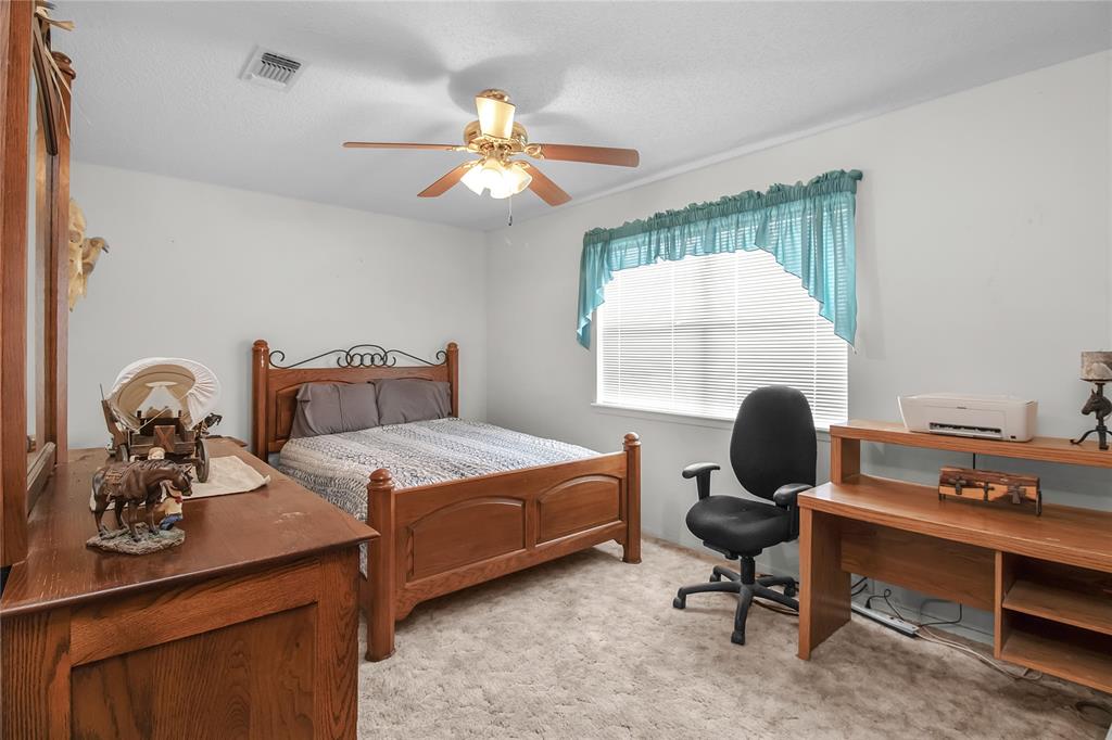 2102 County Road 233 Ballinger, TX 76821 - Photo 10 of 16 a bedroom with bed and a window