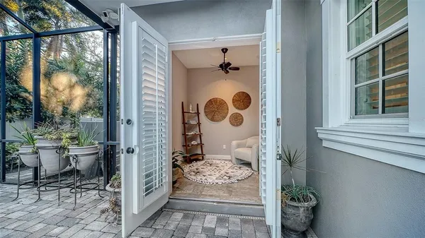 a bedroom with a bed couch and window