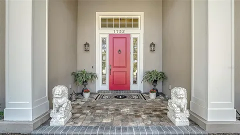 a view of porch with a table and chairs