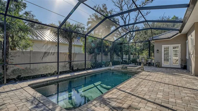 a view of a backyard with a tub and wooden floor