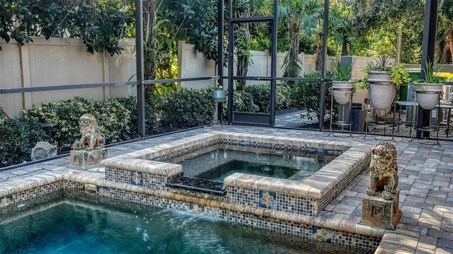 a view of a backyard with sitting area