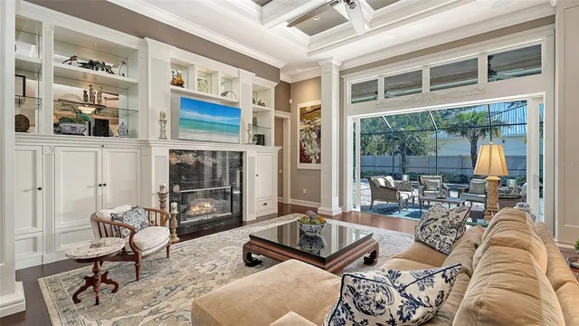 a living room with furniture fireplace and flat screen tv