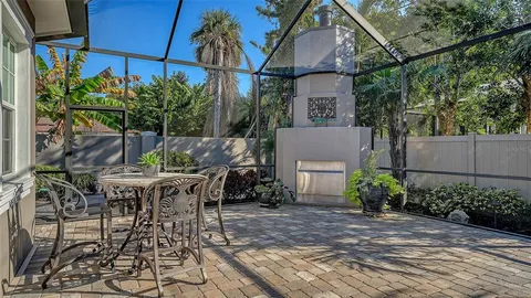 a view of a patio with table and chairs and potted plants