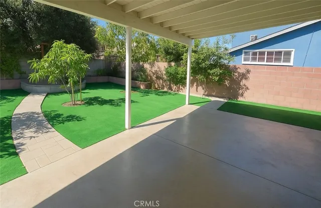 a view of a backyard with garden