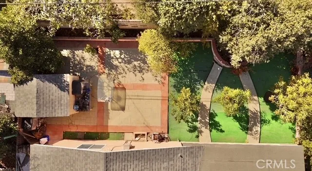 an aerial view of residential house with outdoor space