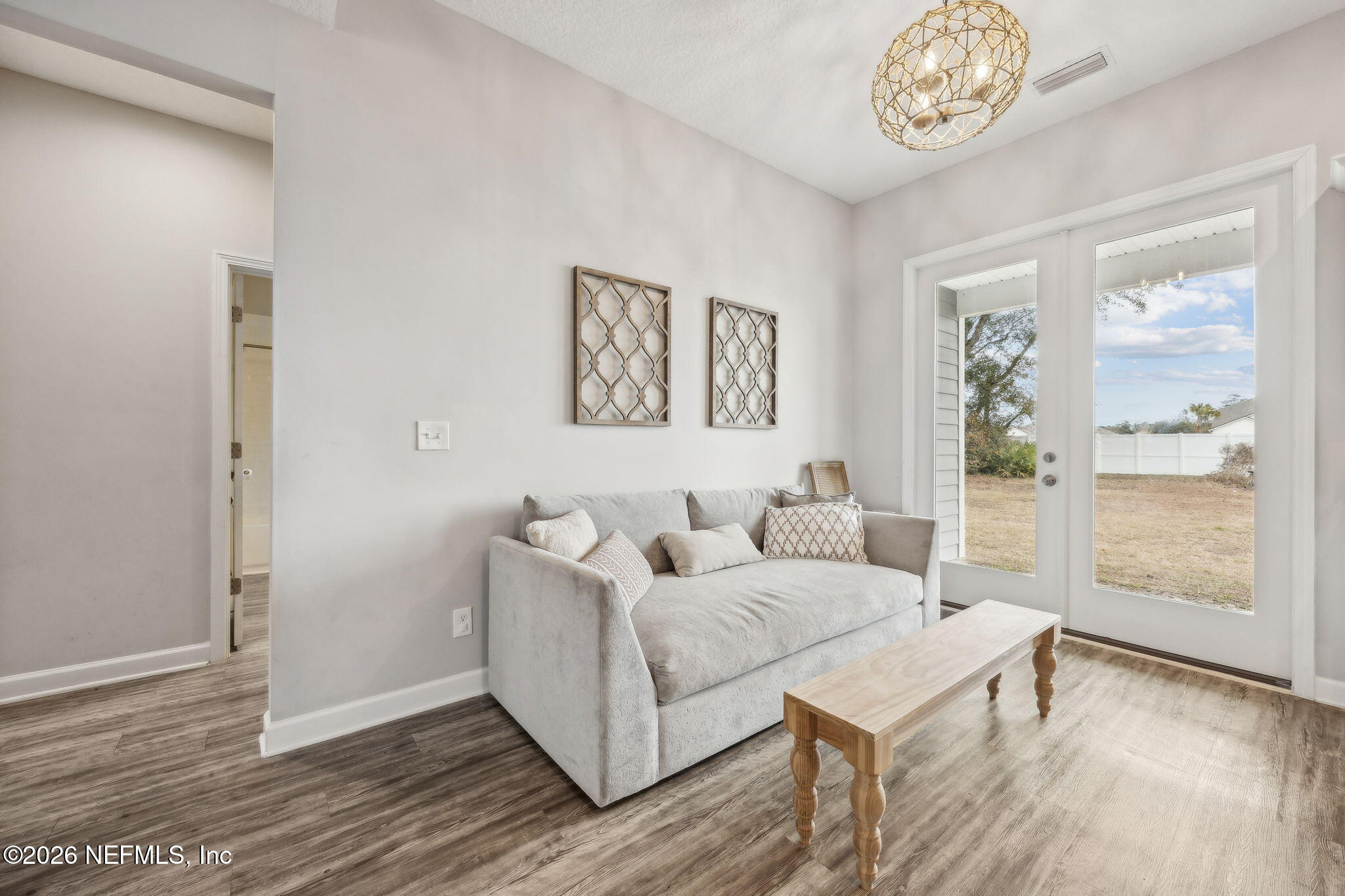 96718 Blackrock Road Yulee, FL 32097 - Photo 27 of 54 a living room with furniture and wooden floor