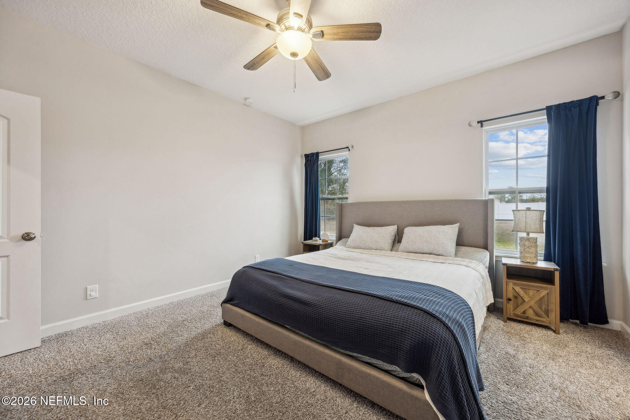 96718 Blackrock Road Yulee, FL 32097 - Photo 30 of 54 a bedroom with a bed and window