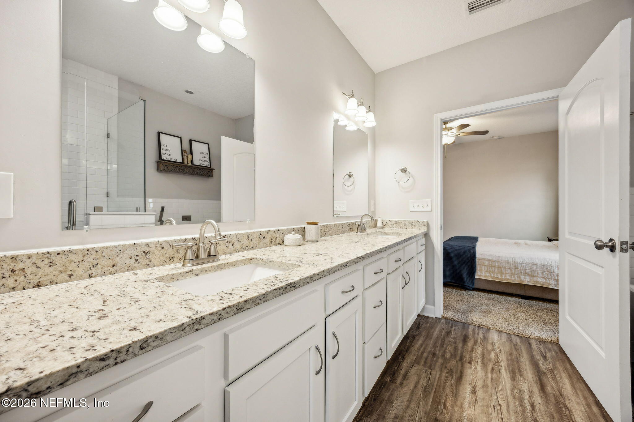 96718 Blackrock Road Yulee, FL 32097 - Photo 33 of 54 a bathroom with a granite countertop double vanity sink and mirror