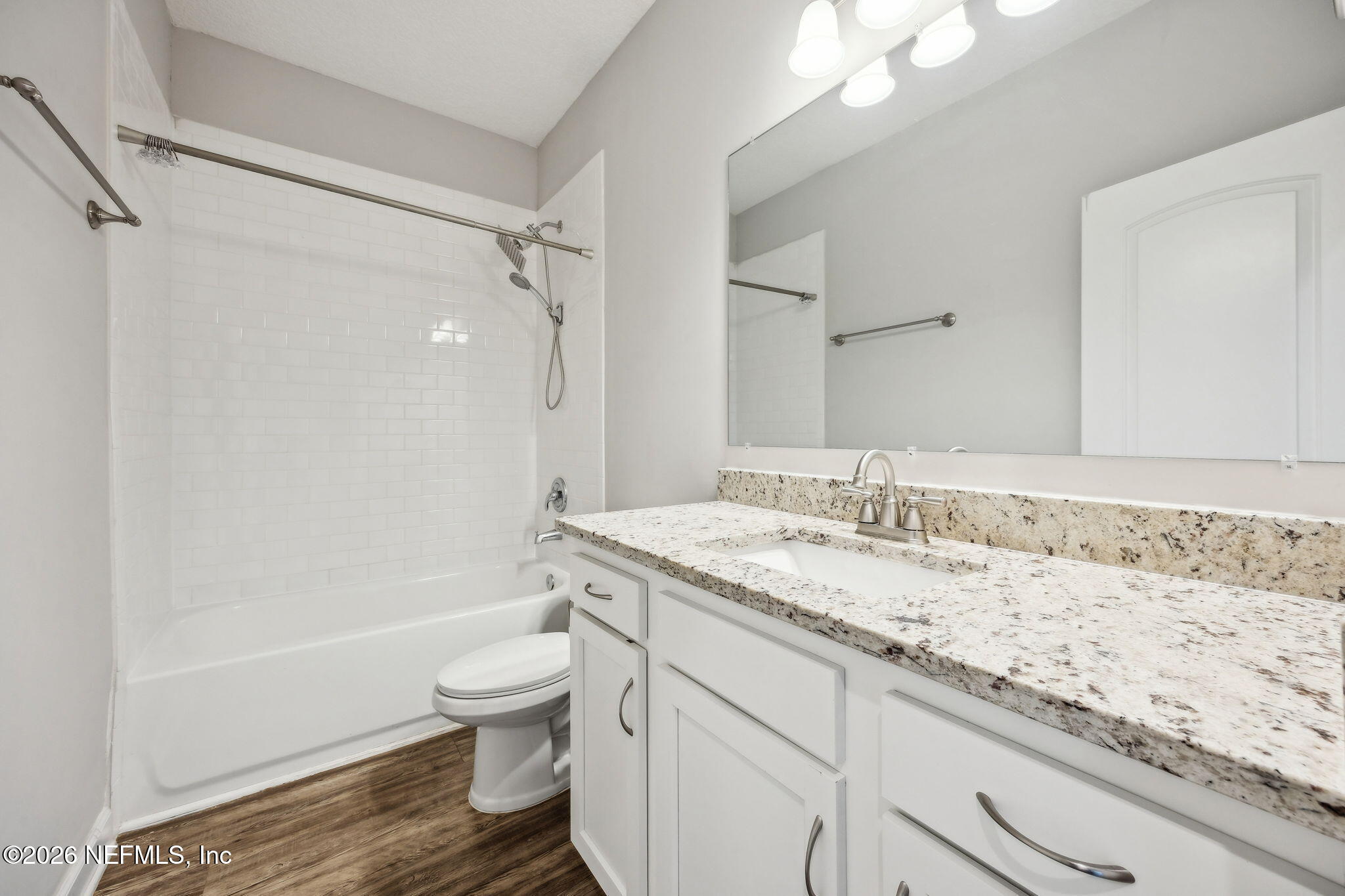 96718 Blackrock Road Yulee, FL 32097 - Photo 40 of 54 a bathroom with a granite countertop sink a toilet and shower