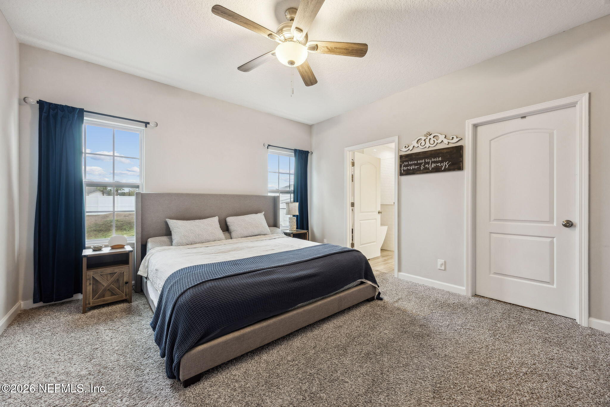 96718 Blackrock Road Yulee, FL 32097 - Photo 4 of 54 a spacious bedroom with a bed and a ceiling fan