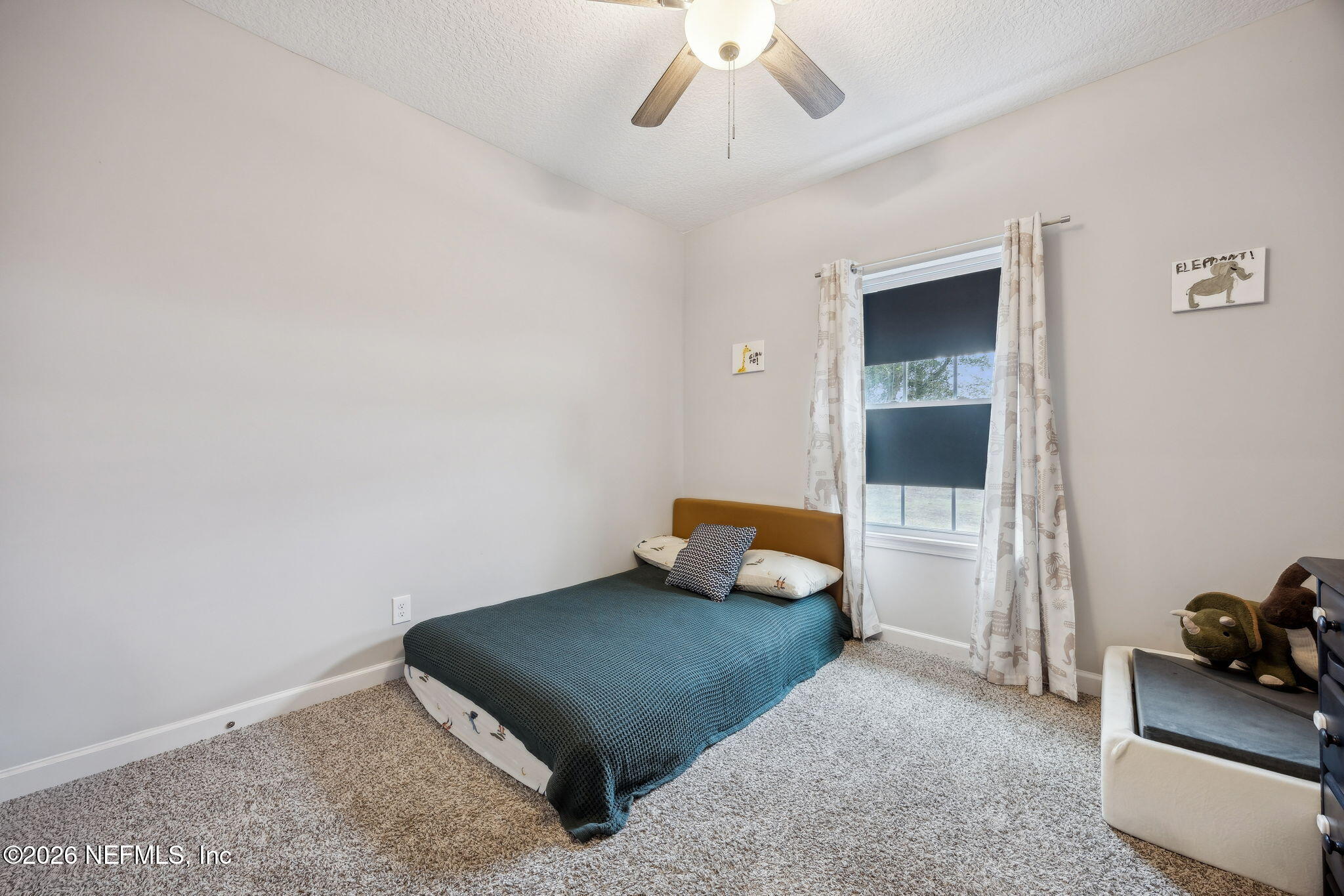 96718 Blackrock Road Yulee, FL 32097 - Photo 42 of 54 a bedroom with furniture and a window