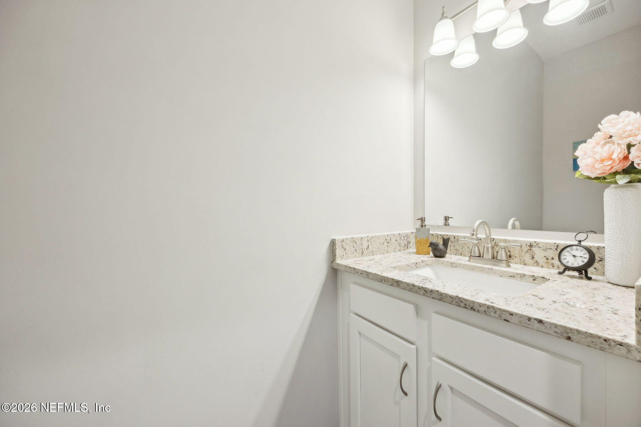 96718 Blackrock Road Yulee, FL 32097 - Photo 44 of 54 a bathroom with a granite countertop sink and a mirror