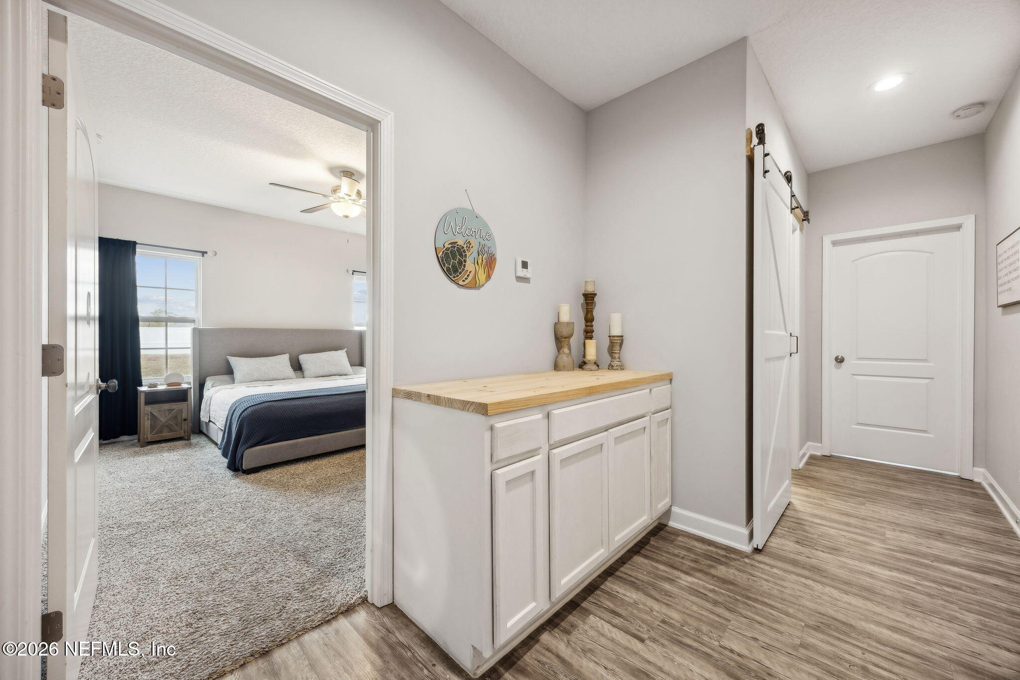 96718 Blackrock Road Yulee, FL 32097 - Photo 45 of 54 a en suite bathroom with a double vanity sink and a mirror