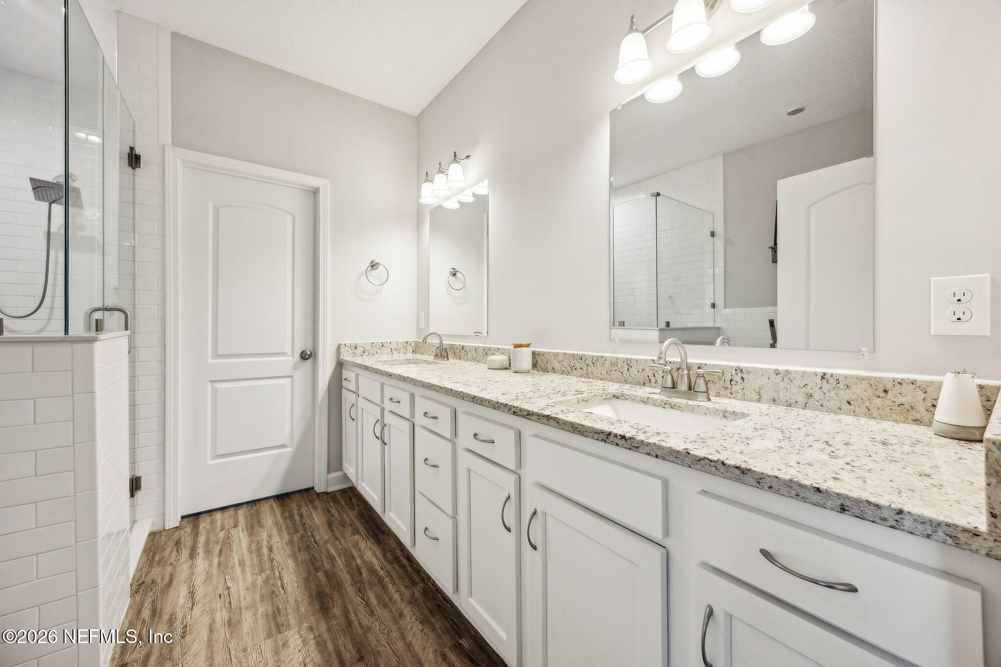 96718 Blackrock Road Yulee, FL 32097 - Photo 5 of 54 a bathroom with a granite countertop double vanity sink and mirror