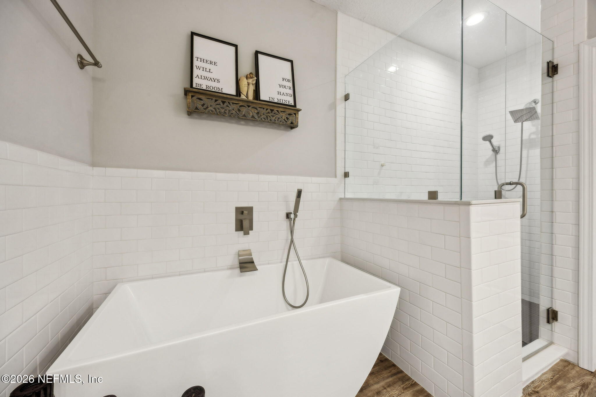 96718 Blackrock Road Yulee, FL 32097 - Photo 6 of 54 a bathroom with a white bath tub sitting next to shower