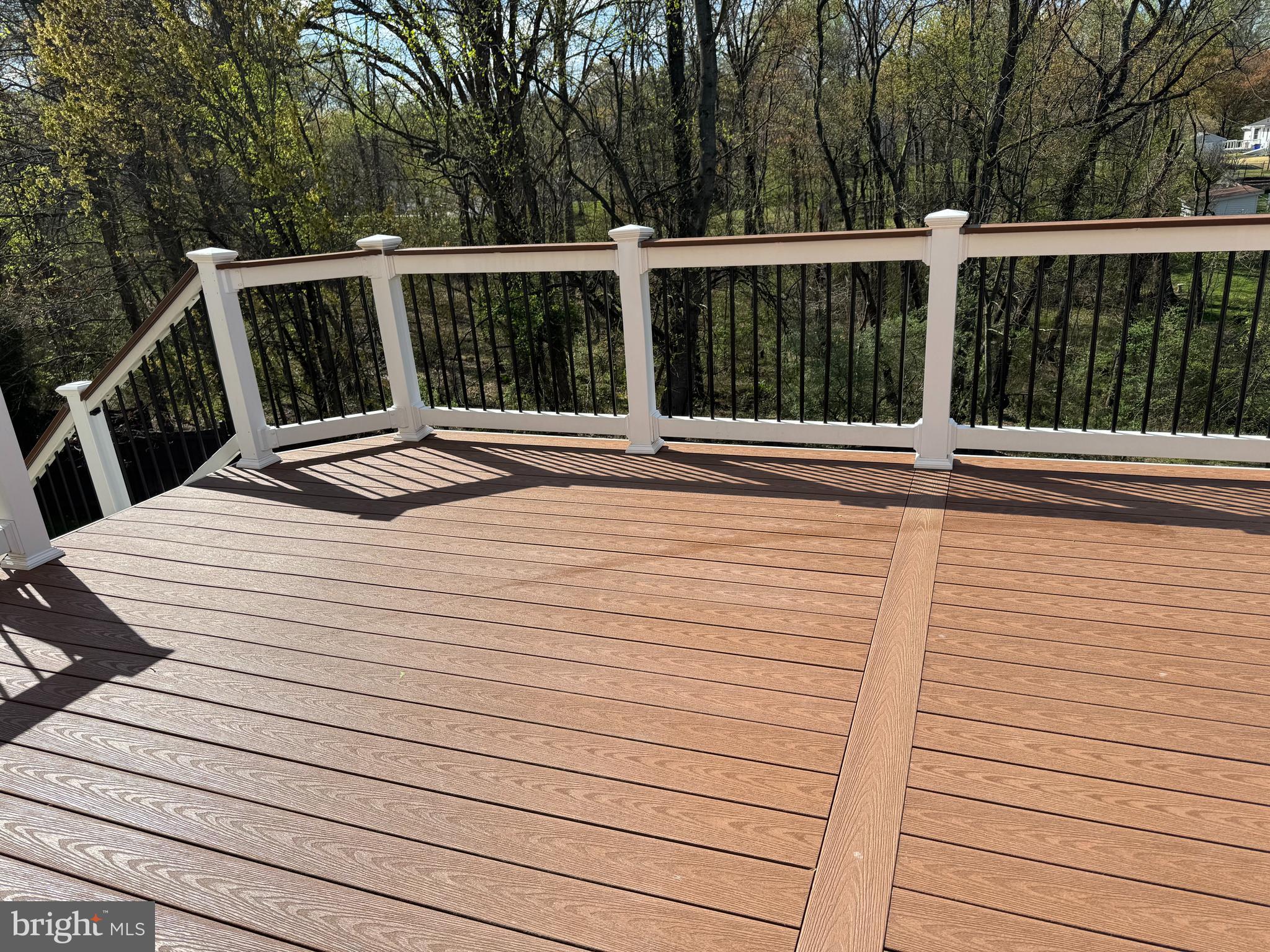 9531 Rommel Drive Columbia, MD 21046 - Photo 44 of 54 a view of a balcony with wooden floor