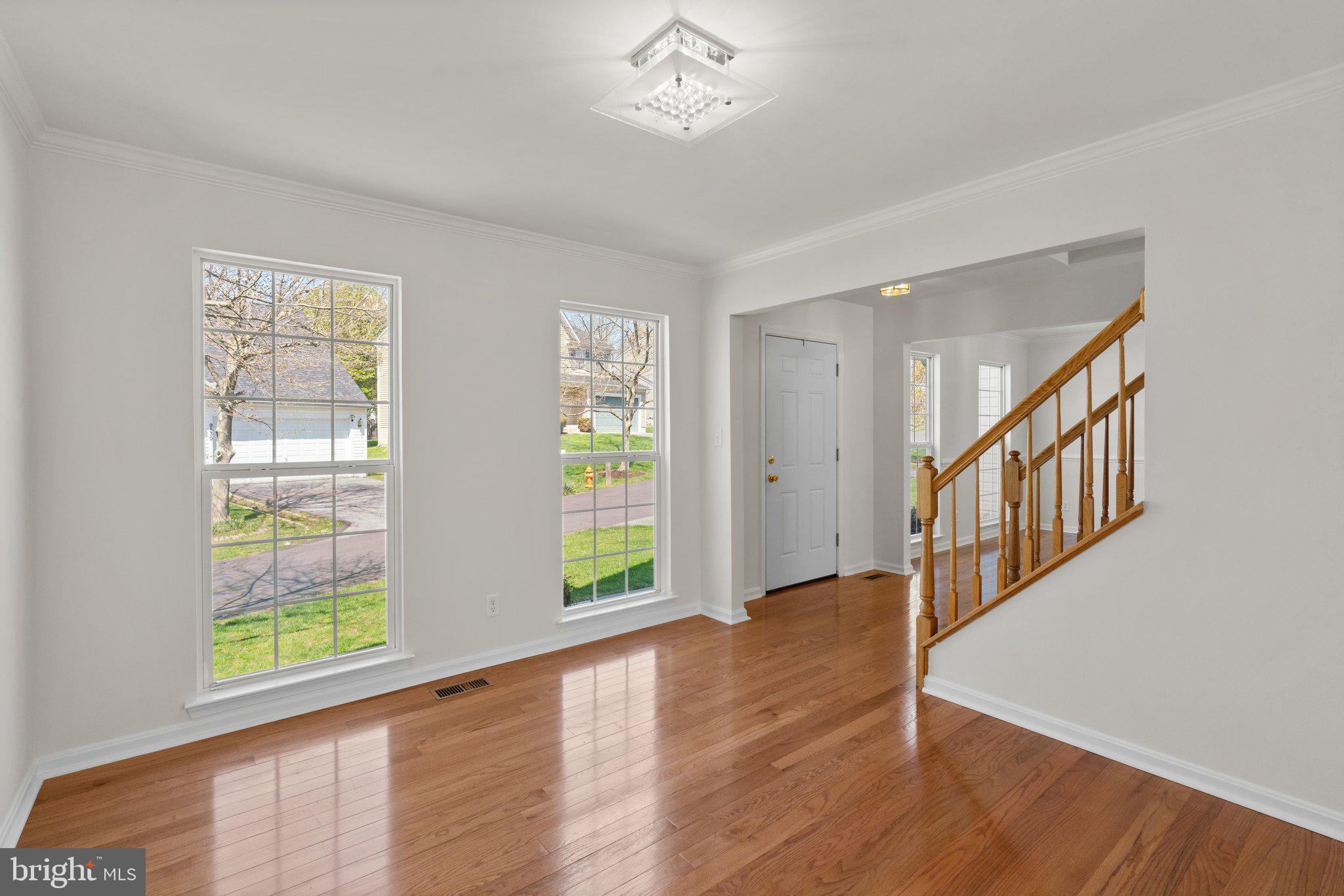 9531 Rommel Drive Columbia, MD 21046 - Photo 5 of 54 wooden floor in an empty room with a window