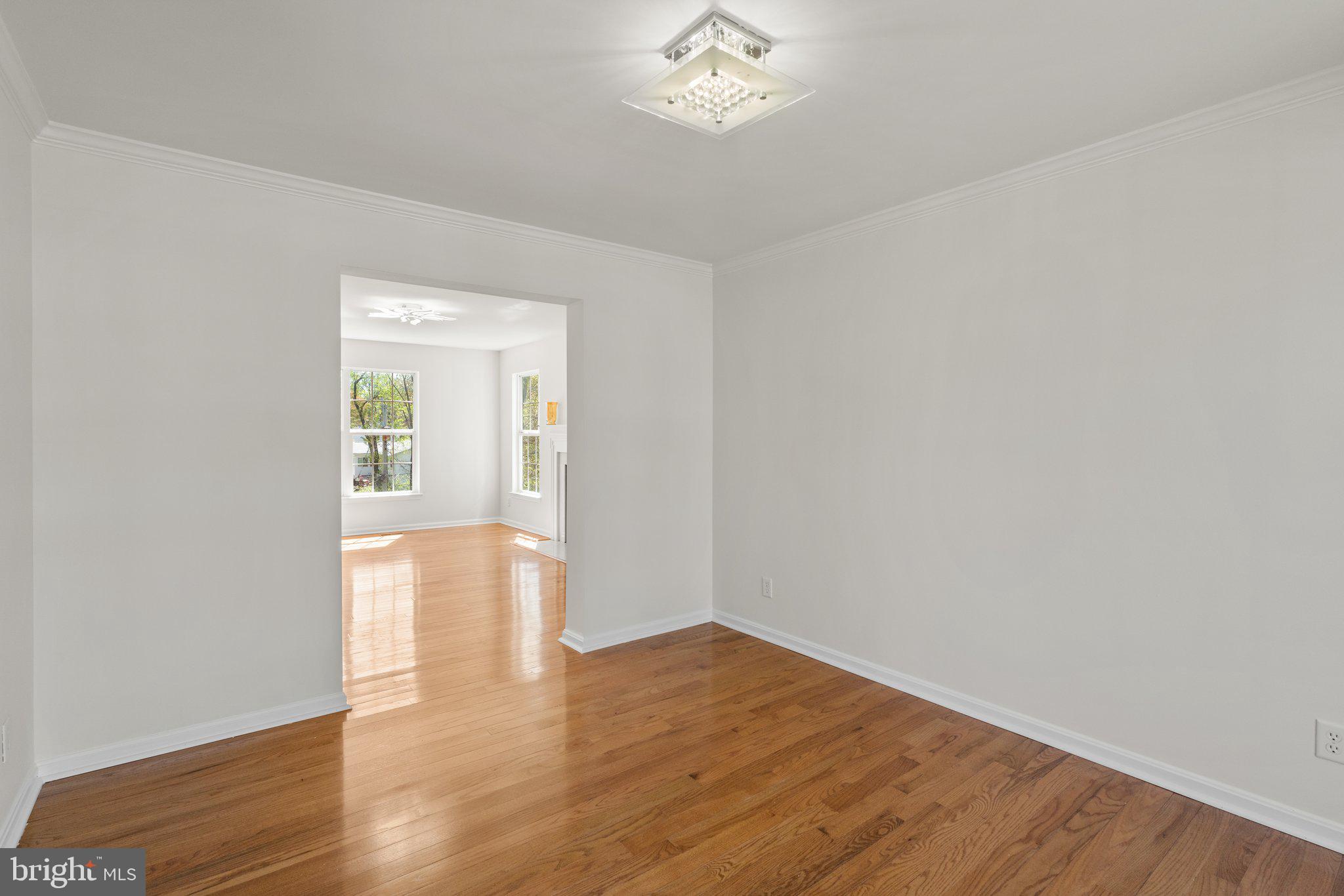 9531 Rommel Drive Columbia, MD 21046 - Photo 7 of 54 a view of an empty room with wooden floor