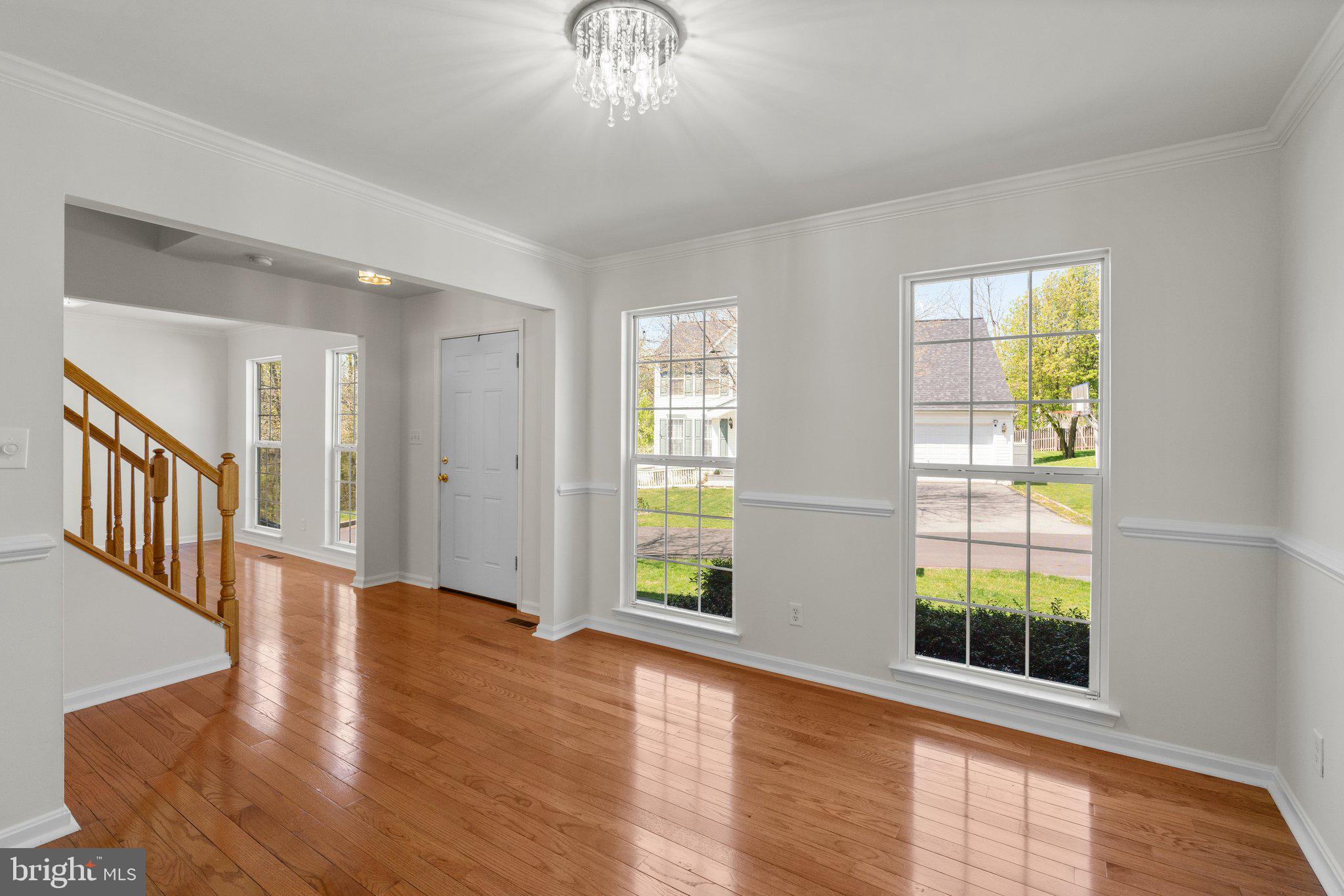 9531 Rommel Drive Columbia, MD 21046 - Photo 8 of 54 a view of an empty room with wooden floor and a window