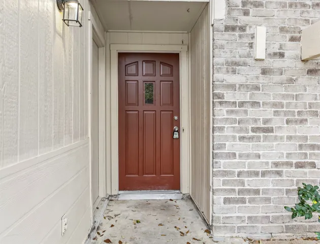 a view of a hallway with a door