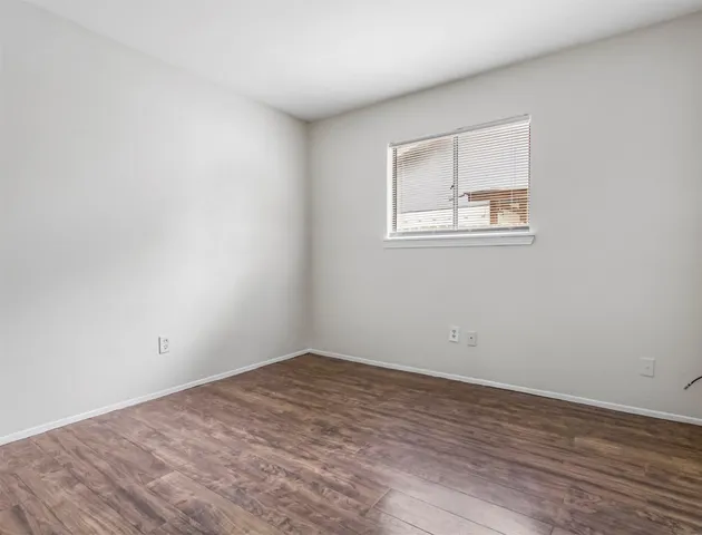 a view of a room that has a window in it