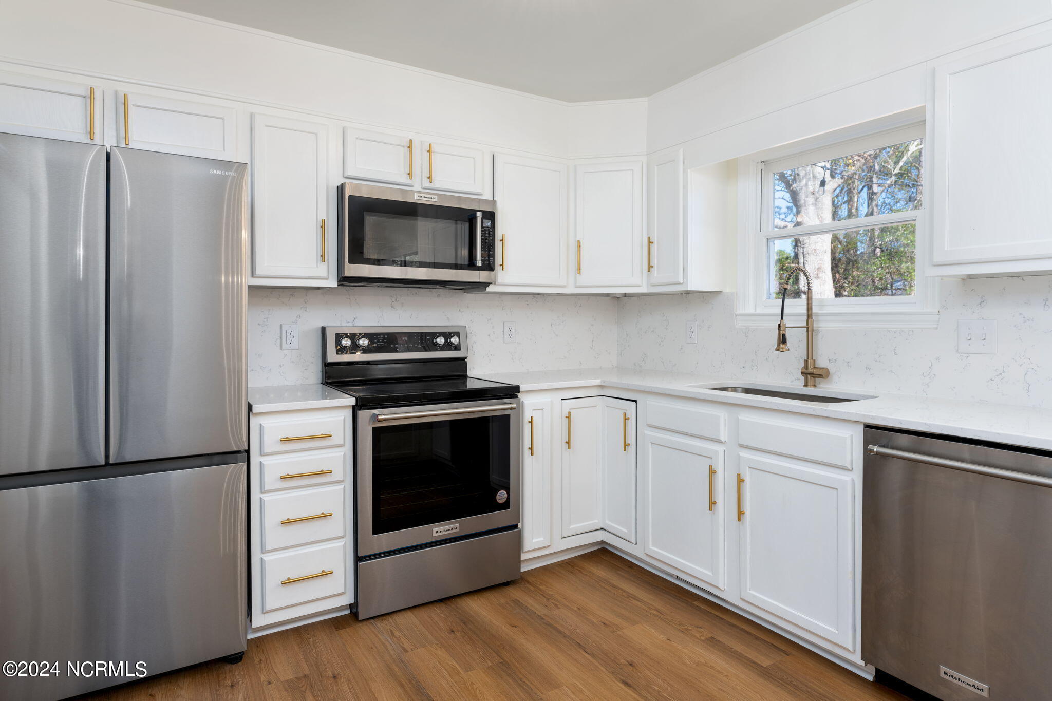 229 2 Chopt Road Wilmington, NC 28405 - Photo 25 of 73 Isn't she lovely? Soft-close cabinets and gold hardware.