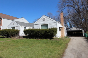 23827 North Overhill Drive Lake Zurich, IL 60047 - Photo 1 of 1 a front view of a house with a yard and garage