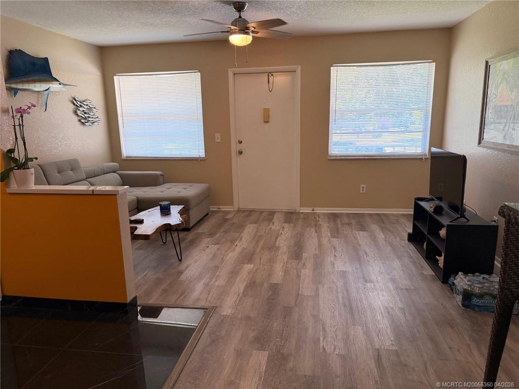 1225 Northwest 21st Street, Unit 3211 Stuart, FL 34994 - Photo 12 of 33 a view of a workspace with furniture and a window
