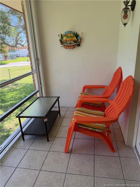 1225 Northwest 21st Street, Unit 3211 Stuart, FL 34994 - Photo 21 of 33 a wooden bench sitting in front of a window