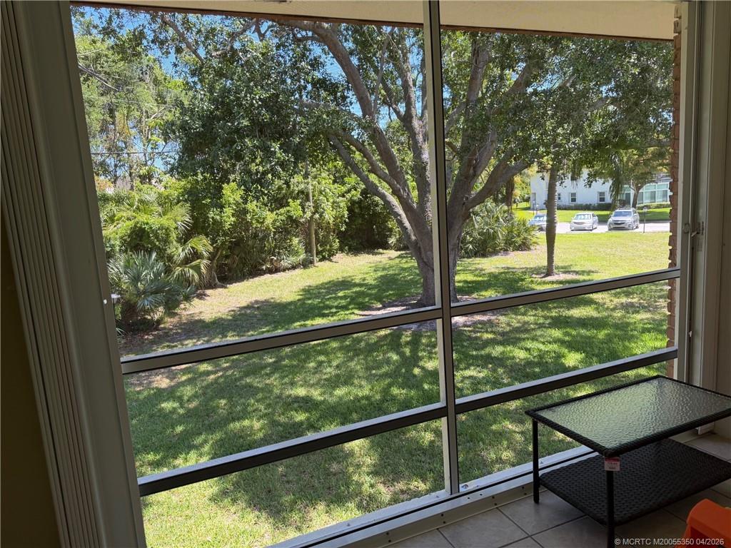 1225 Northwest 21st Street, Unit 3211 Stuart, FL 34994 - Photo 22 of 33 a view of a two chair in the balcony