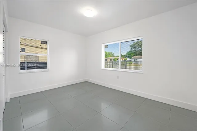 an empty room with windows