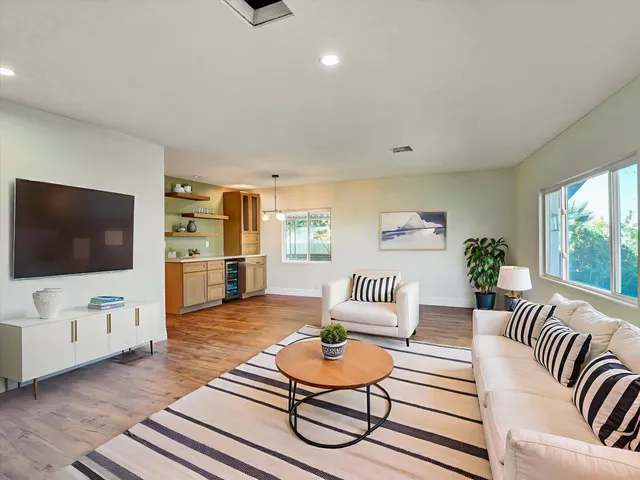 a bathroom with a shower sink and mirror